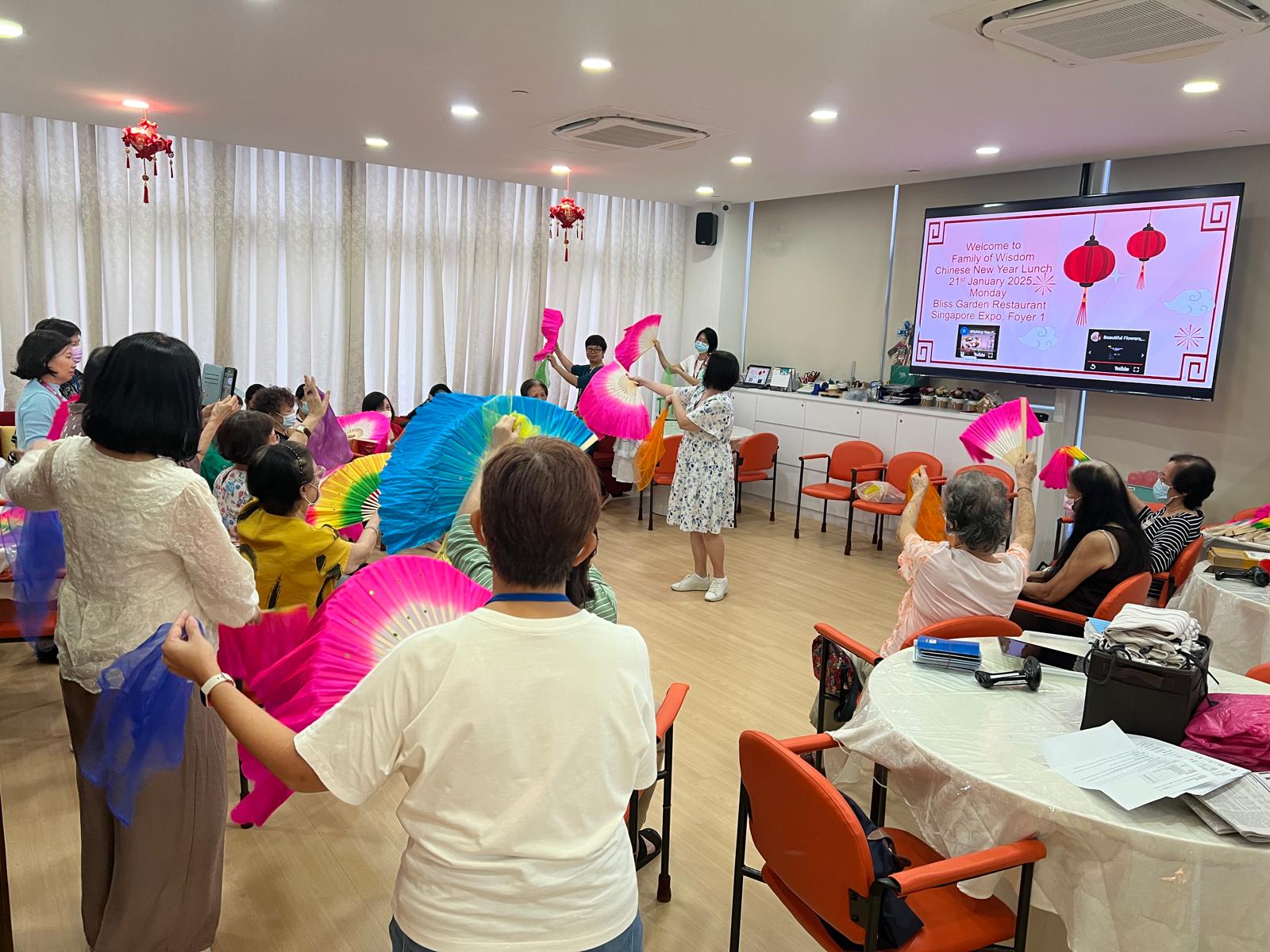Clients n staff practising for performance held at FOW annual CNY lunch